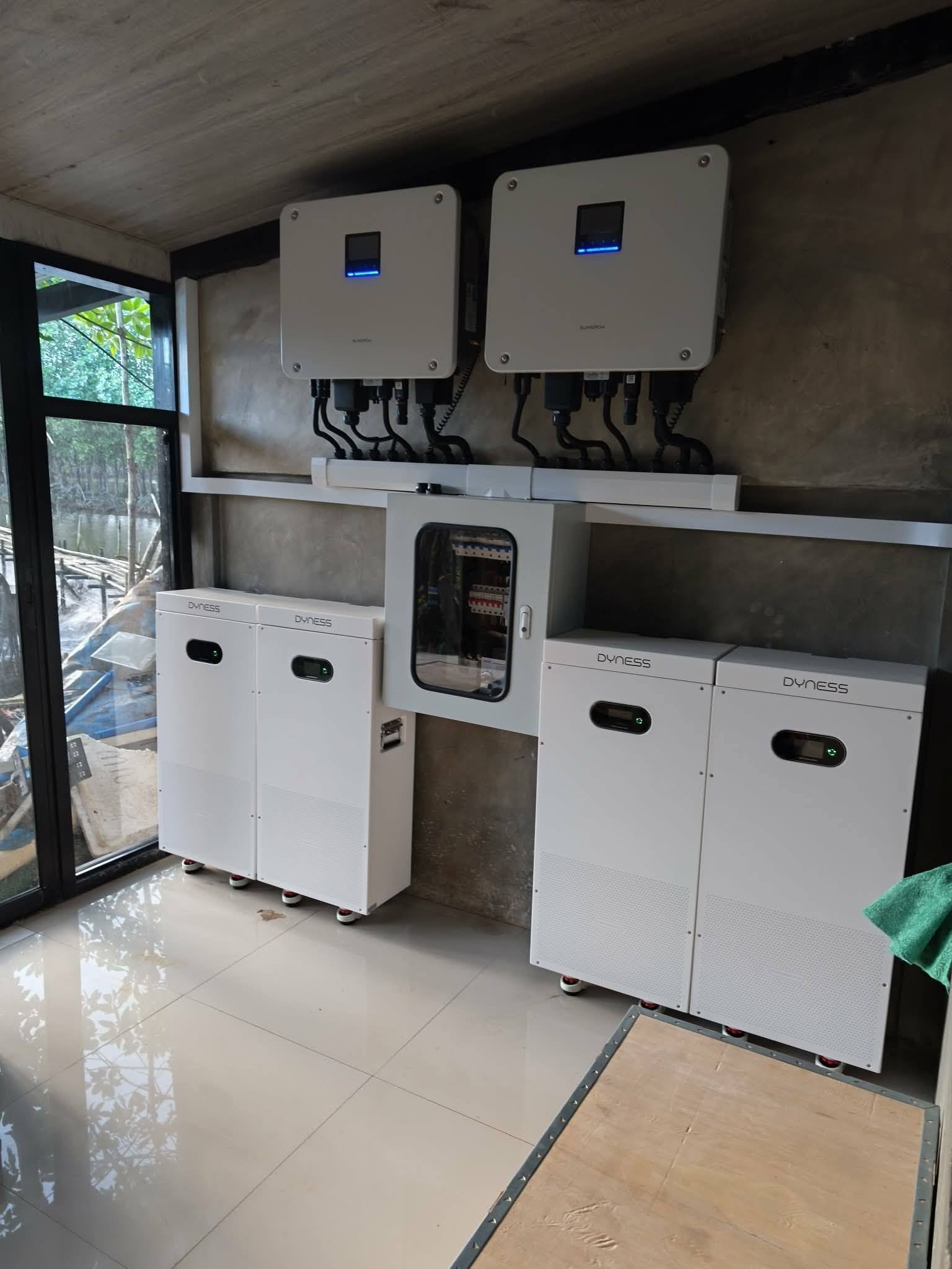 Solar inverters and battery equipment being installed at the Brackish farm